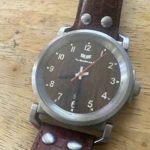 Mens vestal watch with wood grain face & brown leather band.